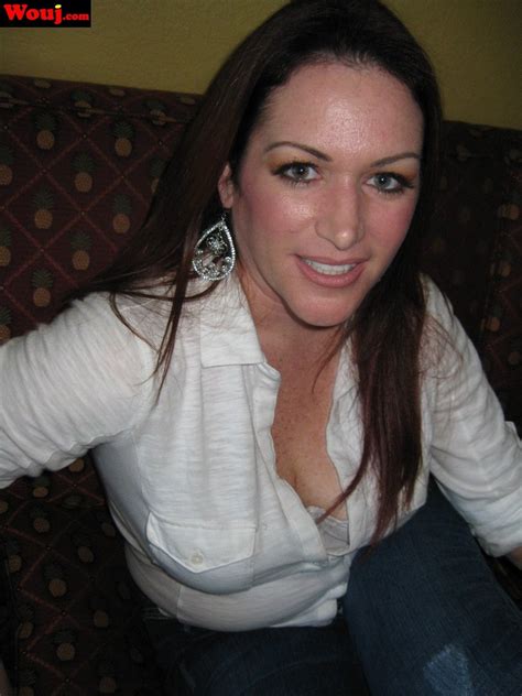 Gorgeous Brunette Chick Posing Fully Clothed On The Couch Photos