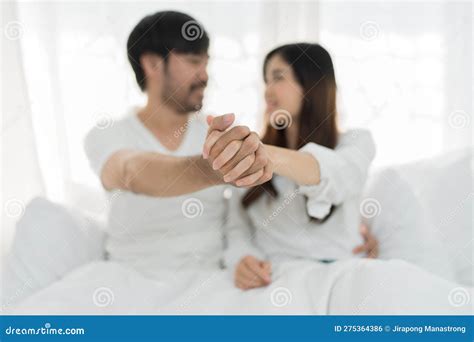 Asian Romantic Couple In Bed Enjoying Sensual Foreplay Happy Sensual Young Couple Lying In Bed