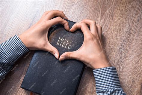 Premium Photo Holy Bible With Heart Shape Hands