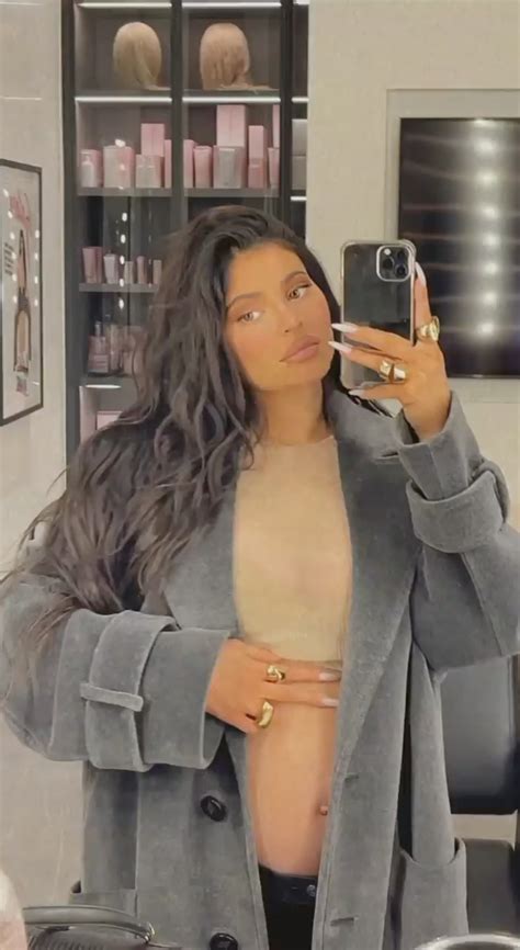 Pregnant Kylie Jenner Cradles Her Baby Bump In Nude Crop Top After Revealing She S Expecting