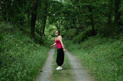 Premium Photo Blonde Walks Through The Woods