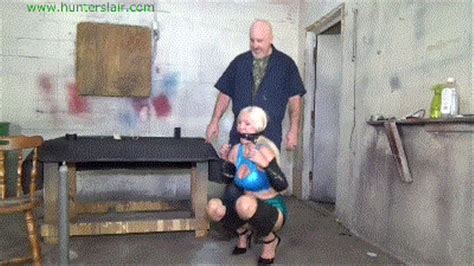 Busty Blond MILF Taped Up Tight On The Girlie Go Round HD 6000kbps Hunters Lair Bondage