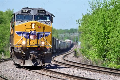 With Its Train Strung Out Behind A Locomotive Leads An Union Pacific