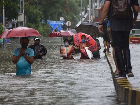 Heavy Rain Batters Indias Mumbai Disrupting Rail And Road Traffic