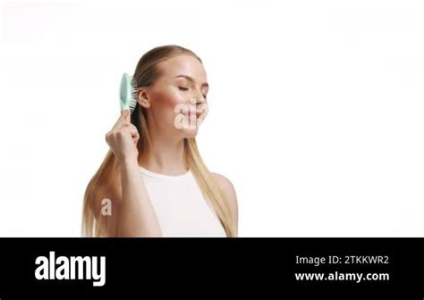 Luxurious Blonde Combing Her Long Hair White Background Stock Video Footage Alamy