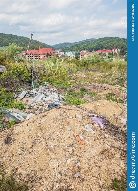 Garbage Dump In The Mountains Half Buried Garbage In The Wooded Stock