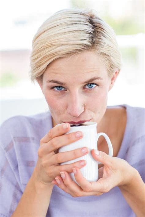 Pretty Blonde Woman Relaxing On The Couch And Holding A Mug Stock Photo Image Of Leisure