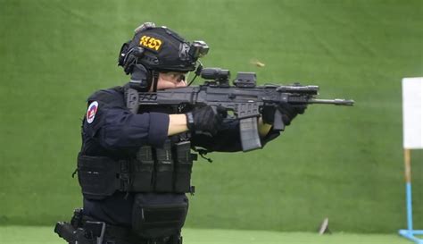 Gendarme from the Royal Gendarmerie of Cambodia (GRK) during an indoor exercise. [1872x1080] : r ...