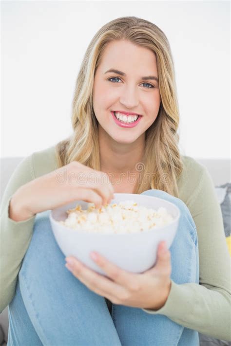 Cheerful Pretty Blonde Eating Popcorn Sitting On Cosy Sofa Stock Image Image Of Years Curly