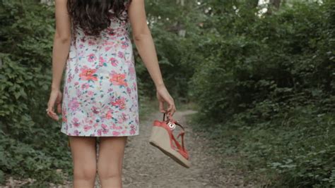 Stock Video Of Brunette In A Dress Goes Barefoot 14043683 Shutterstock
