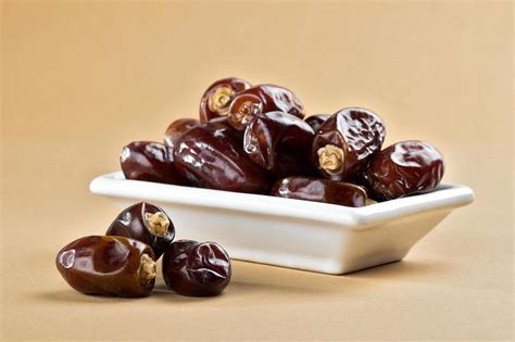 Dried dates on minimal background 1223614 Stock Photo at Vecteezy