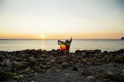 Naked Man Waving An Lgtbi Flag Standing On The Beach During Sunset Stock Image Image Of