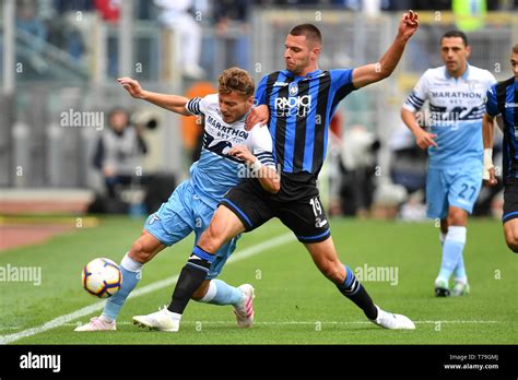 Ciro Immobile Of Lazio And Berat Djimsiti Of Atalanta Compete For The