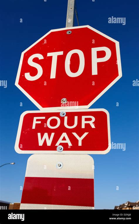 four way stop sign with crosswalk Canada Stock Photo - Alamy