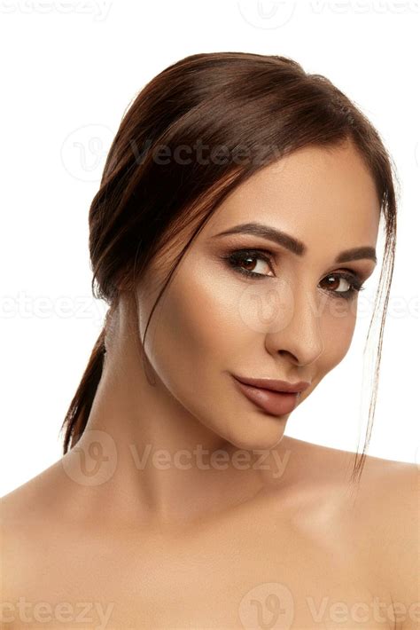 Close Up Portrait Of A Brunette Nude Model Girl With Professional Evening Make Up And Plump Lips