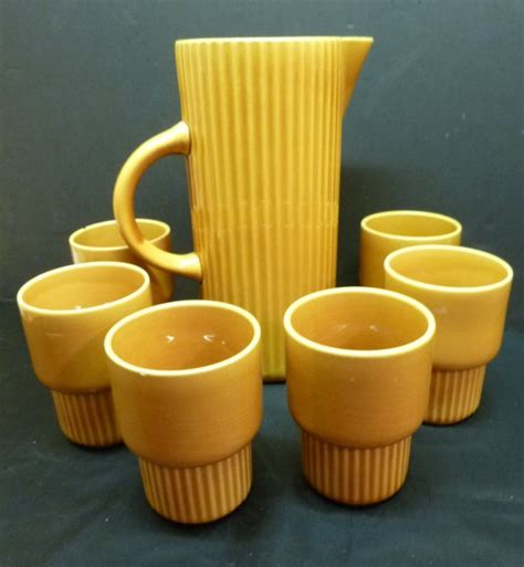 Triangle Huizen Holland High Jug And Six Goblets Ocher Catawiki