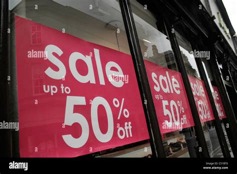 Sale Signs In Shop Window Stock Photo Alamy