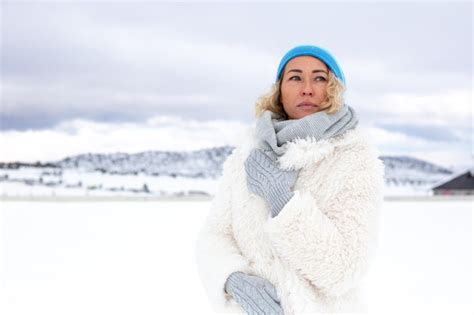 Premium Photo Portrait Of Happy Beautiful Blonde Woman With Snow In Winter Nature