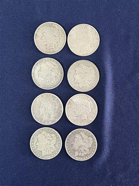 Lot 20: Eight Decent Silver Dollars - Van Metre Auction