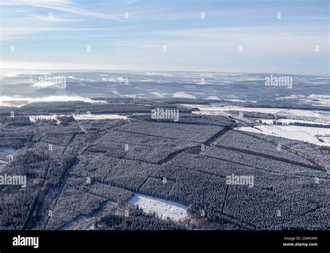 Aerial overview of the Belgian Ardennes during a winter flight with an ...