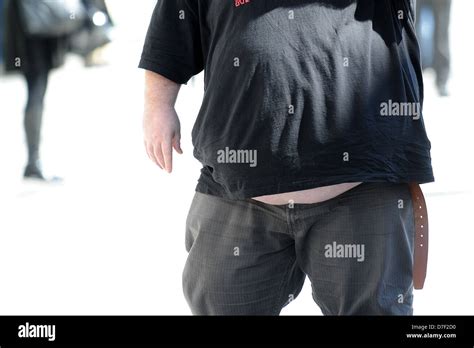An overweight, obese man with belly hanging out Stock Photo: 56264908 ...