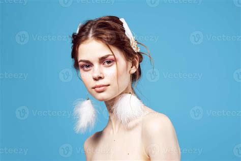 Woman With Fluffy Earrings Nude Shoulders Glamor Blue Background Stock Photo At Vecteezy