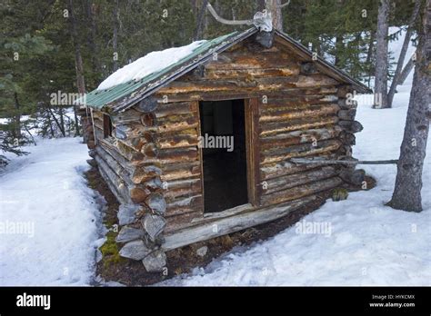 Old Vintage Rustic Log Wooden Pioneer Cabin Exterior in snow covered ...