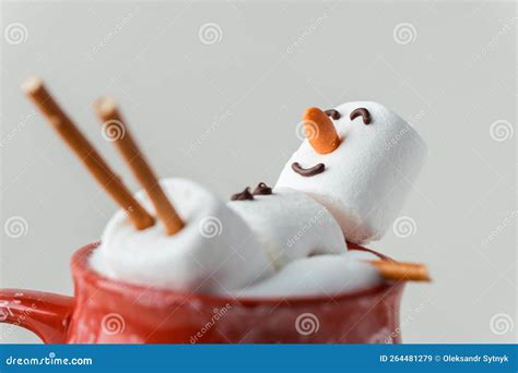 Marshmallow Snowman Taking Hot Tub In A Red Ceramic Cup Full Of Cocoa With Milk Foam Christmas