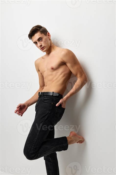 A Man With A Naked Torso In Black Trousers Posing Portrait Of Self