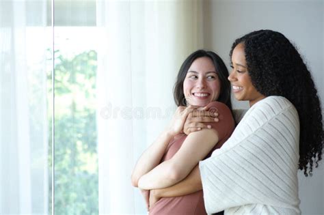 Happy Interracial Lesbian Couple Standing In Love Looking Each Other Stock Photo Image Of