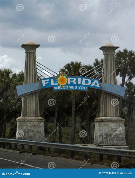 Vertical Shot Of The Welcome To Florida Sign On Tourist Attraction In