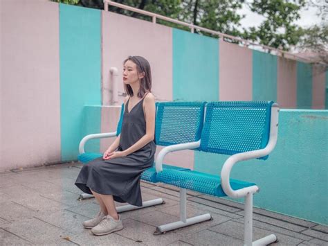 Premium Photo Full Length Of Woman Sitting On Chair