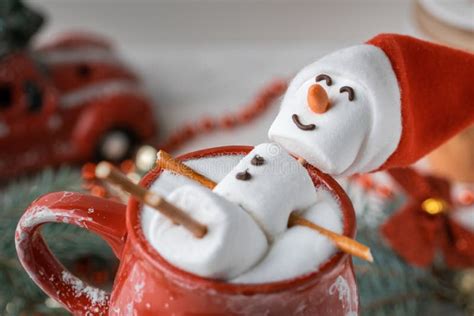 Marshmallow Snowman Taking Hot Tub In A Red Ceramic Cup Full Of Cocoa With Milk Foam Christmas