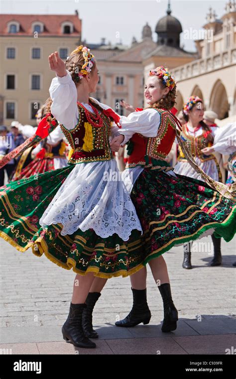 Poland Cracow Polish Girls In Traditional Dress Dancing In Market