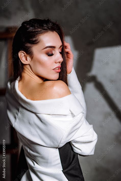 Girl In A Jacket And Sexy Lingerie Posing In A Studio Model Sensually Posing In Retro Loft