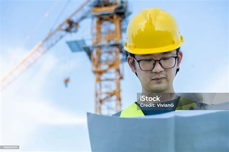 asian general contractor working   construction site stock photo
