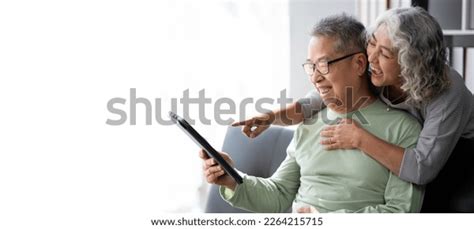 Happy Asian Mature Couple Using Digital Stock Photo Shutterstock