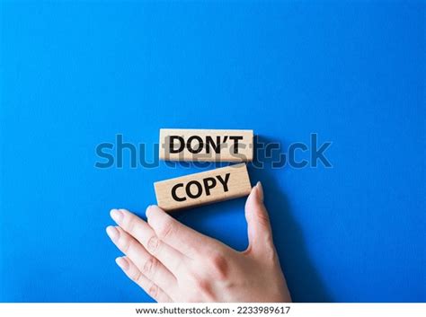 Dont Copy Symbol Wooden Blocks Words Stock Photo 2233989617 Shutterstock