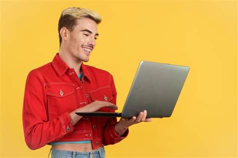 Premium Photo Stylish Gay Man Smiling While Using A Laptop