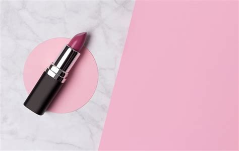 Premium Photo Nude Pink Lipstick On Creative Marble And Pastel Pink Table With Copy Space