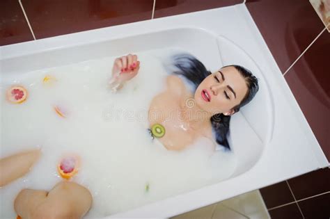 Brunette Girl At The Bathroom With Milk And Fruits Stock Photo Image Of Freshness Jacuzzi