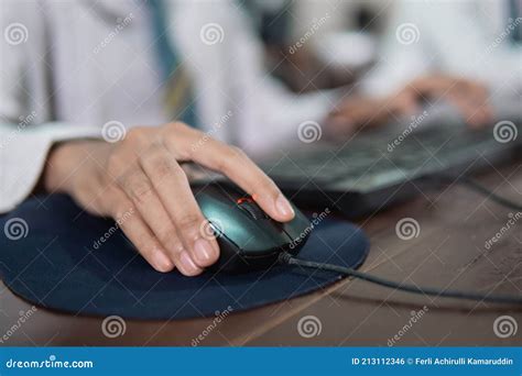 Close Up Of A Female Student X27 S Hand Holding A Mouse While Using A