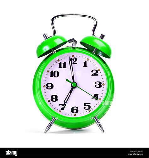 green alarm clock on white Stock Photo - Alamy