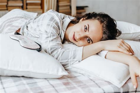 A Sleepy Brunette Girl Lies In Bed With A Blindfold Waking Up In The Morning Cozy Home Morning