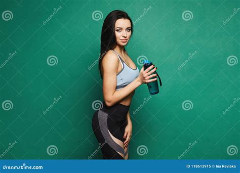 Beautiful And Fitness Model Brunette Girl With Perfect Sporty Body In Sportswear With Geometric