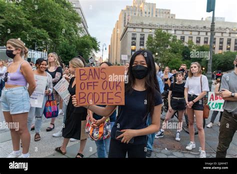 A Crowd Of Protesters Holding Cardboard Signs After The Supreme Court