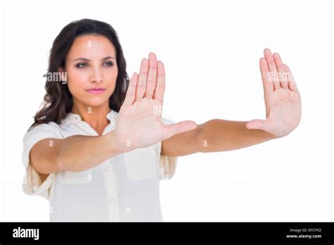 Pretty Brunette Holding Up Hands Stock Photo Alamy