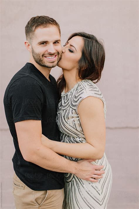 A Woman Giving Her Fiance A Kiss On The Cheek By Stocksy Contributor Kristen Curette