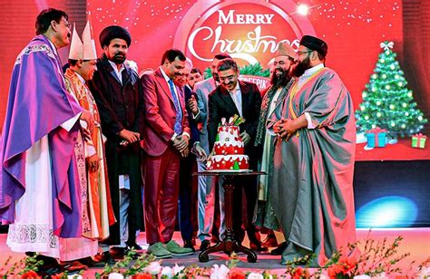 Caretaker Prime Minister Anwaar-ul-Haq Kakar cutting a cake as part of ...