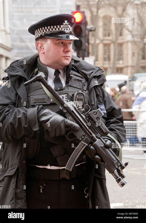 armed police officer  submachine gun  london stock photo royalty